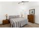 Cozy bedroom featuring neutral tones, carpeted floors, and ample natural light at 5424 Cove Point Dr, Las Vegas, NV 89130