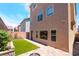 The backyard has artificial turf, brick pavers, and is ready for your summer cookouts at 7029 Parrot Bay Way, Las Vegas, NV 89118