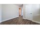 A spacious bedroom with wood floors and a white door is the perfect retreat at 7029 Parrot Bay Way, Las Vegas, NV 89118