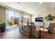 Cozy living room featuring balcony access and plenty of natural light at 7029 Parrot Bay Way, Las Vegas, NV 89118