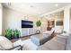 Bright living room with elegant decor, custom bar, and lots of space to relax at 7029 Parrot Bay Way, Las Vegas, NV 89118