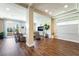 Spacious living room featuring hardwood floors and a balcony with a view at 7029 Parrot Bay Way, Las Vegas, NV 89118