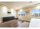 This main bedroom offers wood floors, two windows, and a place to mount your flatscreen television at 7029 Parrot Bay Way, Las Vegas, NV 89118