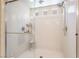 This modern walk-in shower offers a bench, rainfall shower head, and multiple spray options at 7029 Parrot Bay Way, Las Vegas, NV 89118