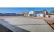Expansive backyard featuring a basketball court and covered patio at 7477 Ullom Dr, Las Vegas, NV 89139
