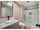Modern bathroom featuring a glass shower and marble countertops at 7477 Ullom Dr, Las Vegas, NV 89139