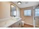 Modern bathroom featuring a vessel sink, stylish mirror, and a glass-enclosed shower at 7477 Ullom Dr, Las Vegas, NV 89139