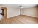 A bright, spacious bedroom with an overhead fan and wood-look flooring at 7477 Ullom Dr, Las Vegas, NV 89139
