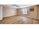 Bedroom featuring wood floors, neutral walls, and a ceiling fan at 7477 Ullom Dr, Las Vegas, NV 89139