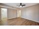 Bedroom featuring wood floors, neutral walls, and a ceiling fan at 7477 Ullom Dr, Las Vegas, NV 89139