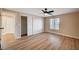 A cozy bedroom featuring wood-look flooring and closet with doors at 7477 Ullom Dr, Las Vegas, NV 89139