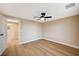 Bedroom with a ceiling fan and wood-look flooring at 7477 Ullom Dr, Las Vegas, NV 89139
