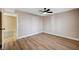 Bedroom featuring wood floors, neutral walls, and a ceiling fan at 7477 Ullom Dr, Las Vegas, NV 89139