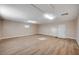 Spacious bonus room featuring wood floors, white trim, and neutral walls at 7477 Ullom Dr, Las Vegas, NV 89139