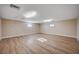 Bonus room with natural light and wood-look floors at 7477 Ullom Dr, Las Vegas, NV 89139