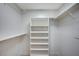 A compact closet with a built-in shelving unit offers efficient storage at 7477 Ullom Dr, Las Vegas, NV 89139