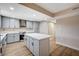Modern kitchen with stainless steel appliances and a center island at 7477 Ullom Dr, Las Vegas, NV 89139