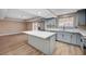 Modern kitchen featuring a center island and an open-concept design at 7477 Ullom Dr, Las Vegas, NV 89139
