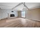 Spacious living room with a fireplace and access to the yard at 7477 Ullom Dr, Las Vegas, NV 89139
