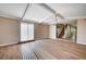 Bright living room featuring wood floors, neutral walls, and beamed ceilings at 7477 Ullom Dr, Las Vegas, NV 89139