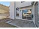 Back patio showcasing a sliding glass door and well-maintained patio hardscape at 7640 Sea Wind Dr, Las Vegas, NV 89128