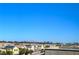 Rooftop view overlooking the city skyline with neighboring houses and solar panels at 7788 Ebro Valley Ct, Las Vegas, NV 89113