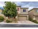 Charming two-story home with a two-car garage and lush front-yard landscaping at 7788 Ebro Valley Ct, Las Vegas, NV 89113