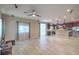 Spacious living room flowing into an open kitchen with stainless steel appliances at 7788 Ebro Valley Ct, Las Vegas, NV 89113