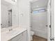 Well-lit bathroom featuring a single vanity and shower-tub combo at 902 Earth Luster Rd, Las Vegas, NV 89178