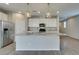 Modern kitchen featuring a large island with granite countertops and stainless steel appliances at 9216 Verdugo Ridge Ct, Las Vegas, NV 89148