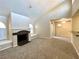 Open living room featuring a cozy fireplace and sliding glass door at 9325 W Desert Inn Rd # 250, Las Vegas, NV 89117