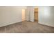 Bright bedroom features neutral carpeting and an en suite bathroom and closet at 9517 Alma Ridge Ave, Las Vegas, NV 89178