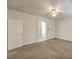 Large carpeted bedroom with an ensuite bath and ample space for furnishings and décor at 9517 Alma Ridge Ave, Las Vegas, NV 89178