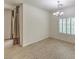 The dining room features wood floors, window with shutters and modern chandelier at 9517 Alma Ridge Ave, Las Vegas, NV 89178
