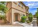 Charming tan two-story home with covered entry and neatly landscaped front yard, sunny skies above at 9517 Alma Ridge Ave, Las Vegas, NV 89178