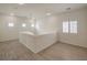 Open hallway area with neutral walls and flooring with windows adding great natural light at 9517 Alma Ridge Ave, Las Vegas, NV 89178