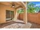 Charming covered patio with brick pavers, ceiling fan and access via sliding glass door at 9517 Alma Ridge Ave, Las Vegas, NV 89178