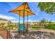 Community playground with sunshade and equipment for enjoyment at 9517 Alma Ridge Ave, Las Vegas, NV 89178