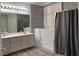 Bathroom featuring gray tiled accent wall, updated vanity and walk-in tub at , Las Vegas, NV 89110