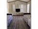 Bedroom with hardwood floors, shutters on windows, and two beds with floral patterned linens at , Las Vegas, NV 89110