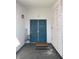 Inviting entryway with a blue double door, welcome sign, and decorative lattice panel at , Las Vegas, NV 89110