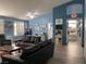 Cozy living room with blue walls, hardwood floors, comfortable seating, and an inviting atmosphere at , Las Vegas, NV 89110
