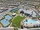 Gorgeous aerial view showcasing the pool, tennis courts, and community clubhouse at 10057 Regency Canyon Way, Las Vegas, NV 89148