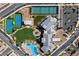 Aerial view of community center with pool, tennis courts, bocce ball, and surrounding landscaping at 10057 Regency Canyon Way, Las Vegas, NV 89148