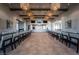 Elegant banquet room complete with tables, chairs and adjacent kitchenette at 10057 Regency Canyon Way, Las Vegas, NV 89148