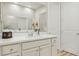 Bright bathroom features a large mirror above the vanity with white countertop at 10057 Regency Canyon Way, Las Vegas, NV 89148