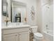 Well-lit bathroom with a single sink vanity and a bathtub-shower combo at 10057 Regency Canyon Way, Las Vegas, NV 89148