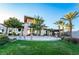 Clubhouse entrance showcasing modern architecture with stone accents, landscaping, and inviting outdoor space at 10057 Regency Canyon Way, Las Vegas, NV 89148