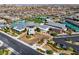 Aerial view of the community center showcasing its amenities, landscaping, and proximity to homes at 10057 Regency Canyon Way, Las Vegas, NV 89148