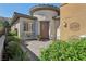 Charming front entrance with a cozy seating area and a stylish front door at 10057 Regency Canyon Way, Las Vegas, NV 89148